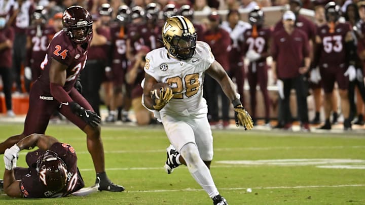 Sep 6, 2025; Blacksburg, Virginia, USA;  Vanderbilt Commodores running back Sedrick Alexander (28) runs for a touchdown during the fourth quarter at Lane Stadium. Mandatory Credit: Brian Bishop-Imagn Images