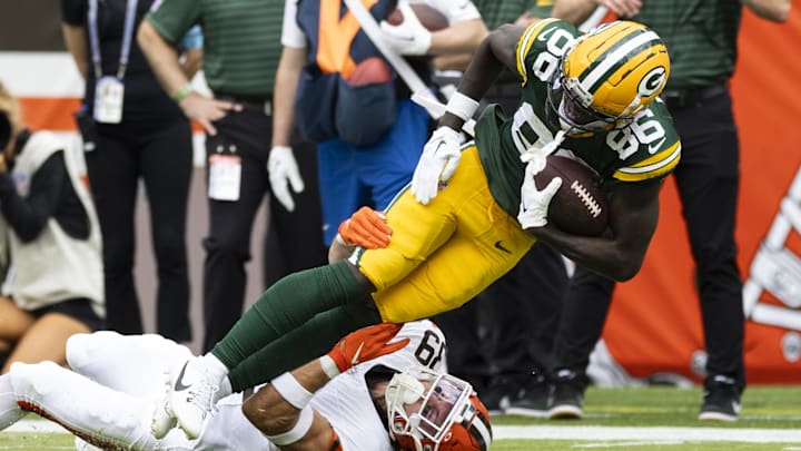 Aug 10, 2024; Cleveland, Ohio, USA; Green Bay Packers wide receiver Grant DuBose (86) runs the ball as Cleveland Browns safety Brady Breeze (39) tackles him during the first quarter at Cleveland Browns Stadium