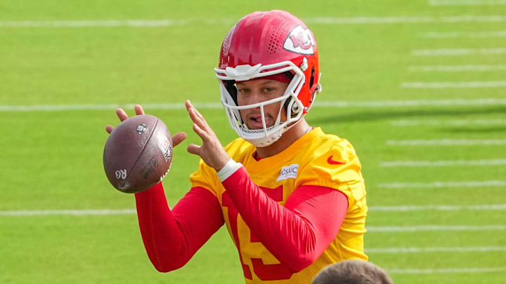 Jul 22, 2025; St. Joseph, MO, USA; Kansas City Chiefs quarterback Patrick Mahomes (15) receives a snap during training camp at Missouri Western State University. Mandatory Credit: Denny Medley-Imagn Images