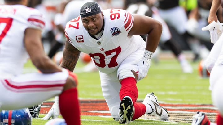 Sep 22, 2024; Cleveland, Ohio, USA; New York Giants defensive tackle Dexter Lawrence II (97) stretches during warm-ups before the game against the Cleveland Browns at Huntington Bank Field.  