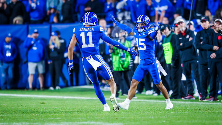 BYU defensive backs Tayvion Beasley and Faletau Satuala against Utah