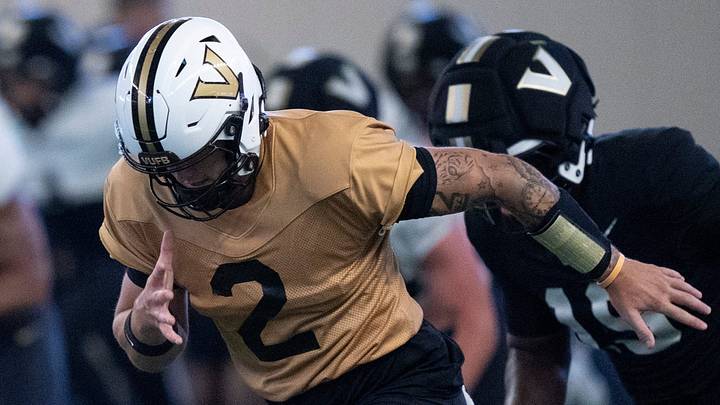 Vanderbilt quarterback Jared Curtis (2) goes through warmups during preseason practice at the school’s indoor facility Friday, Aug. 14, 2026.
