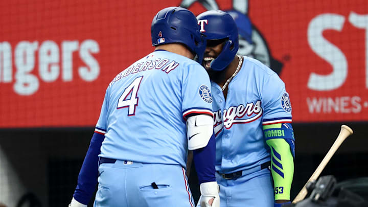 Texas Rangers designated hitter Joc Pederson (4) celebrates with Texas Rangers right fielder Adolis Garcia (53) after hitting a two-run home run during the first inning against the Philadelphia Phillies at Globe Life Field. Texas Rangers designated hitter Joc Pederson (4) celebrates with Texas Rangers right fielder Adolis Garcia (53) after hitting a two-run home run during the first inning against the Philadelphia Phillies at Globe Life Field.