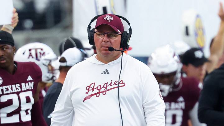 Texas A&M Aggies head coach Mike Elko during the first half against the Arkansas Razorbacks at AT&T Stadium. Texas A&M Aggies head coach Mike Elko during the first half against the Arkansas Razorbacks at AT&T Stadium.
