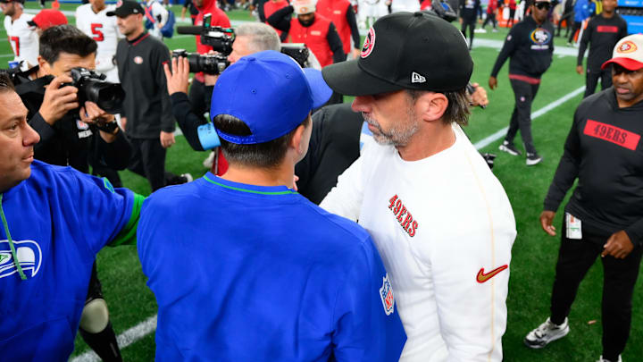 Oct 10, 2024; Seattle, Washington, USA; Seattle Seahawks Mike McDonald and San Francisco 49ers head coach Kyle Shanahan greet after the game at Lumen Field. 