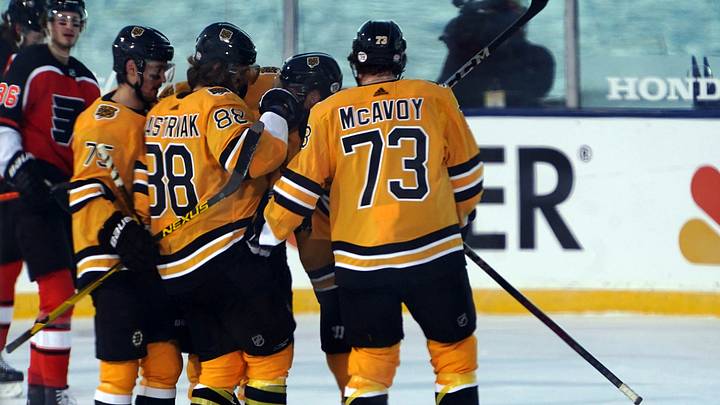 Feb 21, 2021; Stateline, Nevada, USA; Boston Bruins defenseman Charlie McAvoy (73) celebrates with teammates after a goal against the Philadelphia Flyers during the first period in a NHL Outdoors hockey game at Lake Tahoe. Mandatory Credit: Kirby Lee-USA TODAY Sports Feb 21, 2021; Stateline, Nevada, USA; Boston Bruins defenseman Charlie McAvoy (73) celebrates with teammates after a goal against the Philadelphia Flyers during the first period in a NHL Outdoors hockey game at Lake Tahoe. Mandatory Credit: Kirby Lee-USA TODAY Sports