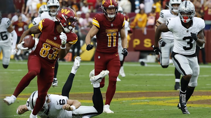 Sep 21, 2025; Landover, Maryland, USA; Washington Commanders wide receiver Jaylin Lane (83) returns a punt for a touchdown as Las Vegas Raiders running back Zamir White (3) chases during the third quarter at Northwest Stadium. Mandatory Credit: Geoff Burke-Imagn Images Sep 21, 2025; Landover, Maryland, USA; Washington Commanders wide receiver Jaylin Lane (83) returns a punt for a touchdown as Las Vegas Raiders running back Zamir White (3) chases during the third quarter at Northwest Stadium. Mandatory Credit: Geoff Burke-Imagn Images