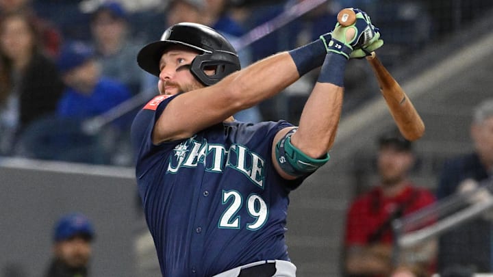 Apr 20, 2025; Toronto, Ontario, CAN;  Seattle Mariners catcher designated hitter Cal Raleigh (29) hits a two run home run against the Toronto Blue Jays in the first inning at Rogers Centre. 