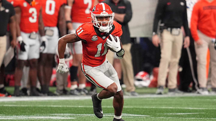 Dec 7, 2024; Atlanta, GA, USA; Georgia Bulldogs wide receiver Arian Smith (11) makes a catch against the Texas Longhorns during the second half in the 2024 SEC Championship game at Mercedes-Benz Stadium. Mandatory Credit: Dale Zanine-Imagn Images
