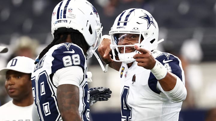 Dallas Cowboys quarterback Dak Prescott and Ceedee Lamb celebrate a touchdown against the Washington Commanders 