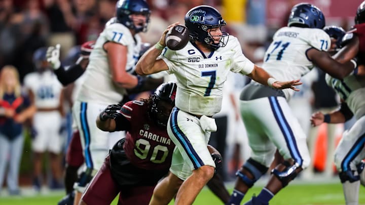 Aug 31, 2024; Columbia, South Carolina, USA; Old Dominion Monarchs quarterback Grant Wilson (7) throws under pressure from South Carolina Gamecocks defensive tackle DeAndre Jules (99) in the second half at Williams-Brice Stadium. Mandatory Credit: Jeff Blake-Imagn Images Aug 31, 2024; Columbia, South Carolina, USA; Old Dominion Monarchs quarterback Grant Wilson (7) throws under pressure from South Carolina Gamecocks defensive tackle DeAndre Jules (99) in the second half at Williams-Brice Stadium. Mandatory Credit: Jeff Blake-Imagn Images