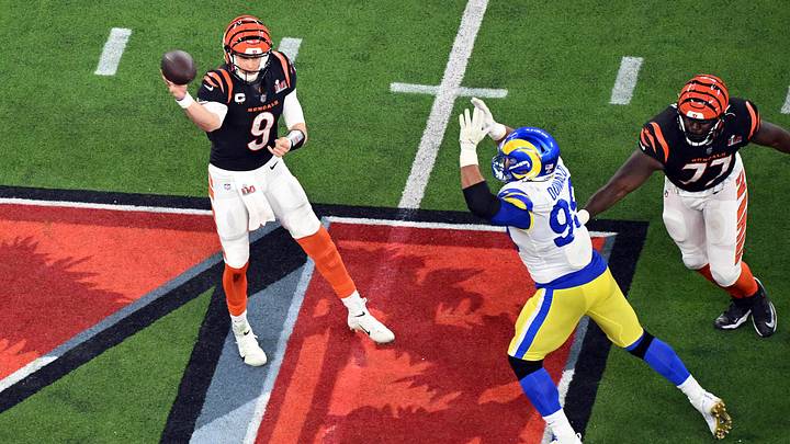 Feb 13, 2022; Inglewood, California, USA; Cincinnati Bengals quarterback Joe Burrow (9) throws against Los Angeles Rams defensive end Aaron Donald (99) in the fourth quarter in Super Bowl LVI at SoFi Stadium. Mandatory Credit: Richard Mackson-Imagn Images Feb 13, 2022; Inglewood, California, USA; Cincinnati Bengals quarterback Joe Burrow (9) throws against Los Angeles Rams defensive end Aaron Donald (99) in the fourth quarter in Super Bowl LVI at SoFi Stadium. Mandatory Credit: Richard Mackson-Imagn Images