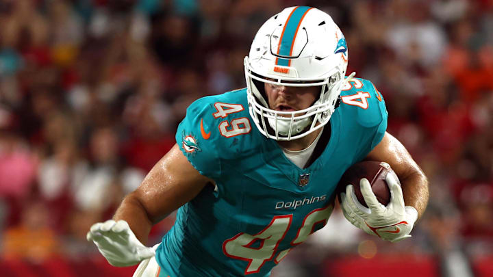 Miami Dolphins tight end Hayden Rucci (49) runs with the ball against the Tampa Bay Buccaneers  during the second half at Raymond James Stadium during the 2023 preseason.