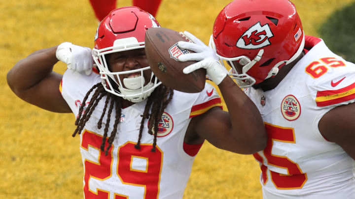 Dec 25, 2024; Pittsburgh, Pennsylvania, USA;  Kansas City Chiefs running back Kareem Hunt (29) reacts with guard Trey Smith (65) after Hunt scored a touchdown against the Pittsburgh Steelers during the fourth quarter at Acrisure Stadium. Mandatory Credit: Charles LeClaire-Imagn Images