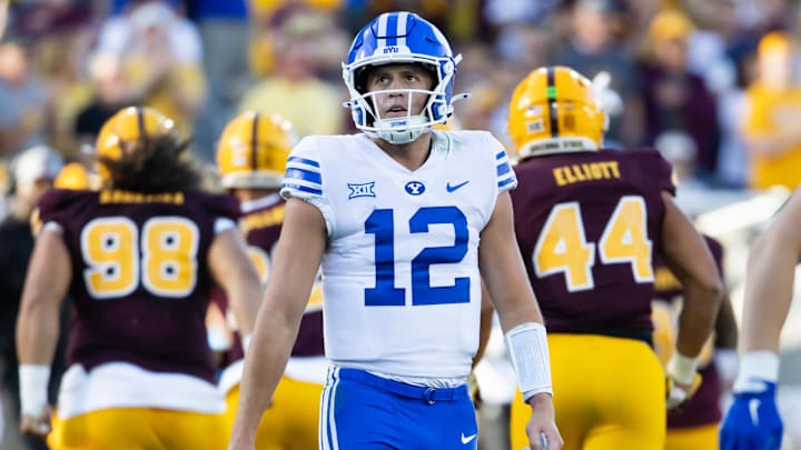 Nov 23, 2024; Tempe, Arizona, USA; Brigham Young Cougars quarterback Jake Retzlaff (12) reacts against the Arizona State Sun Devils in the second half at Mountain America Stadium. 