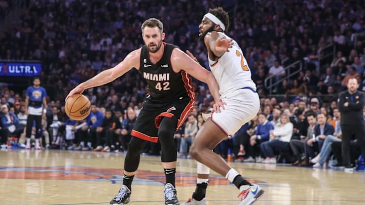 May 10, 2023; New York, New York, USA; Miami Heat forward Kevin Love (42) looks to drive past New York Knicks center Mitchell Robinson (23) during game five of the 2023 NBA playoffs at Madison Square Garden. Mandatory Credit: Wendell Cruz-Imagn Images