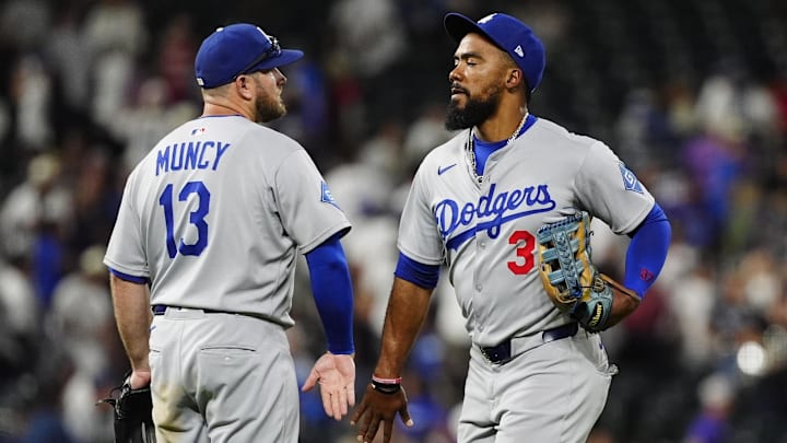 Jun 24, 2025; Denver, Colorado, USA; Los Angeles Dodgers third baseman Max Muncy (13) and right tfielder Teoscar Hernandez (37) celebrate defeating the Colorado Rockies at Coors Field. Mandatory Credit: Ron Chenoy-Imagn Images