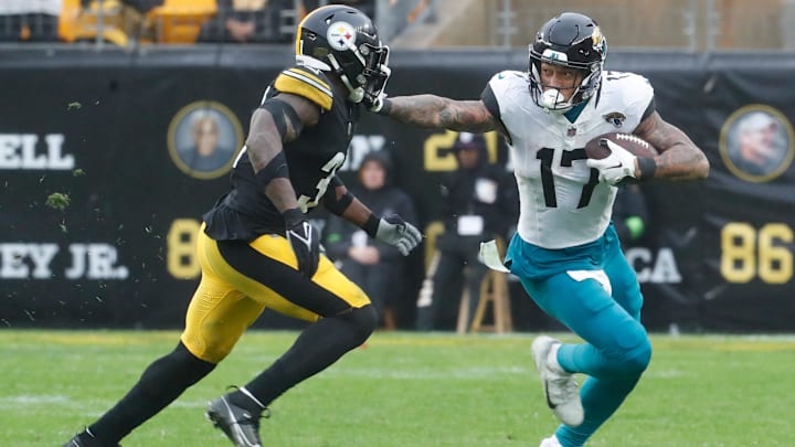 Oct 29, 2023; Pittsburgh, Pennsylvania, USA;  Jacksonville Jaguars tight end Evan Engram (17) against Pittsburgh Steelers safety Keanu Neal (31)  during the fourth quarter at Acrisure Stadium. Jacksonville won 20-10. 