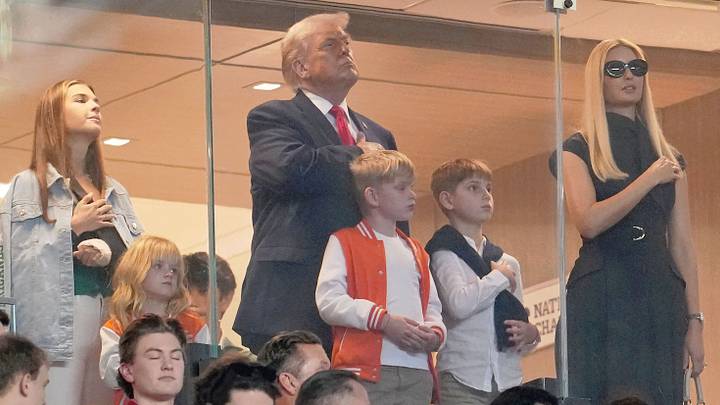 Jan 19, 2026; Miami Gardens, FL, USA; Kai Trump, United States President Donald Trump, and Ivanka Trump look on during the national anthem before the CFP National Championship college football game between the Indiana Hoosiers and the Miami Hurricanes at Hard Rock Stadium. Mandatory Credit: Kirby Lee-Imagn Images Jan 19, 2026; Miami Gardens, FL, USA; Kai Trump, United States President Donald Trump, and Ivanka Trump look on during the national anthem before the CFP National Championship college football game between the Indiana Hoosiers and the Miami Hurricanes at Hard Rock Stadium. Mandatory Credit: Kirby Lee-Imagn Images