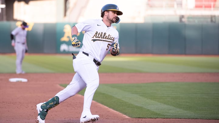 May 21, 2024; Oakland, California, USA; Oakland Athletics designated hitter J.D. Davis (5) rounds the bases after hitting a home run against the Colorado Rockies during the third inning at Oakland-Alameda County Coliseum. Mandatory Credit: Ed Szczepanski-USA TODAY Sports May 21, 2024; Oakland, California, USA; Oakland Athletics designated hitter J.D. Davis (5) rounds the bases after hitting a home run against the Colorado Rockies during the third inning at Oakland-Alameda County Coliseum. Mandatory Credit: Ed Szczepanski-USA TODAY Sports