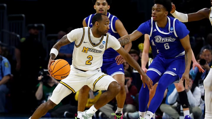 Mar 20, 2025; Wichita, KS, USA; Missouri Tigers guard Tamar Bates (2) dribbles against Drake Bulldogs guard Tavion Banks (6) in the second half of a first round men’s NCAA Tournament game at Intrust Bank Arena. Mandatory Credit: Nick Tre. Smith-Imagn Images Mar 20, 2025; Wichita, KS, USA; Missouri Tigers guard Tamar Bates (2) dribbles against Drake Bulldogs guard Tavion Banks (6) in the second half of a first round men’s NCAA Tournament game at Intrust Bank Arena. Mandatory Credit: Nick Tre. Smith-Imagn Images