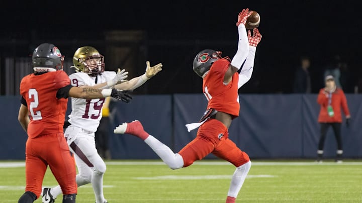 Toledo Central Catholic's Victor Singleton Jr. intercepts a pass intended Bishop Watterson   s Cal Mangini ending the Eagles' final drive during the Division III state final Friday, Dec. 1, 2023, in Canton.