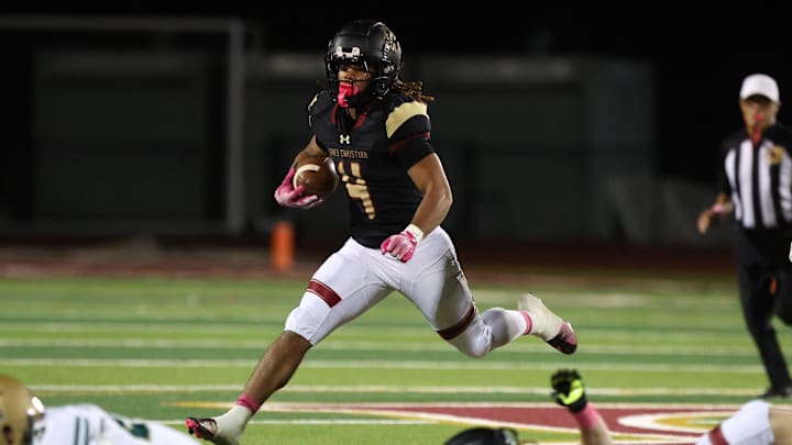 Running back Deshonne Redeaux looks for running room during the third quarter of Oaks Christian's 35-0 Marmonte League win over St. Bonaventure Friday night at Redell Field.