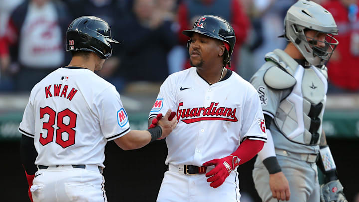 Cleveland Guardians' Jose Ramirez (11) celebrates with teammate Steven Kwan (38) at home after his two-run home run during the Guardians' home opener against the Chicago White Sox on April 8, 2024, in Cleveland, Ohio.