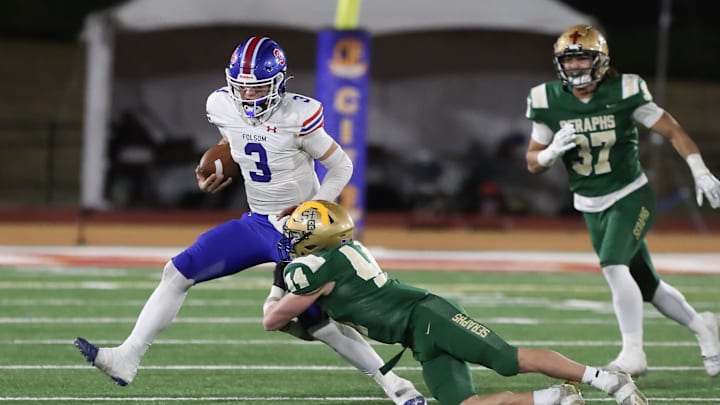 St. Bonaventure's Dylan Dunst tackles Folsom quarterback Ryder Lyons during the fourth quarter of the CIF-State Division 1-A state championship bowl at Saddleback College in Mission Viejo on Saturday, Dec. 9, 2023. St. Bonaventure lost 20-14.