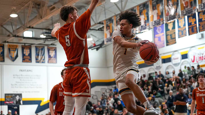 Stony Point guard Uzziah Buntyn (1) passes the ball past Westwood's Luke Carpenter (5) during the game at Stony Point High School on Friday, Jan. 3, 2025 in Round Rock, Texas.