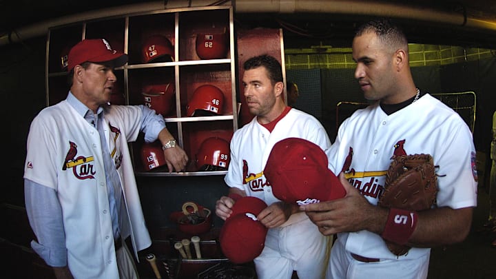 August 2, 2005; St. Louis, MO, USA; St. Louis Cardinals Albert Pujols (5) and Jim Edmonds (15) chat with ESPN anchorman Dan Patrick before the game against the Florida Marlins at Busch Stadium. Mandatory Credit: Photo by Scott Rovak-Imagn Images August 2, 2005; St. Louis, MO, USA; St. Louis Cardinals Albert Pujols (5) and Jim Edmonds (15) chat with ESPN anchorman Dan Patrick before the game against the Florida Marlins at Busch Stadium. Mandatory Credit: Photo by Scott Rovak-Imagn Images