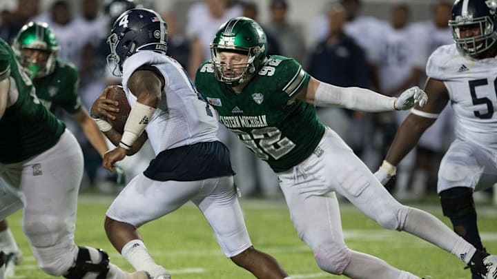 Georgia Southern quarterback Shai Werts (4) is taken down by Eastern Michigan defensive lineman Maxx Crosby (92) during the Camellia Bowl at Cramton Bowl in Montgomery, Ala., on Saturday, Dec. 15, 2018. Georgia Southern defeated Eastern Michigan 23-21. 

Jc Camellia 31