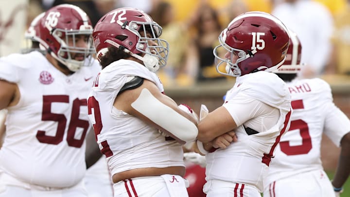 Oct 11, 2025; Columbia, Missouri, USA;  Alabama Crimson Tide quarterback Ty Simpson (15) and offensive lineman Parker Brailsford (72) celebrate against the Missouri Tigers during the first half at Faurot Field at Memorial Stadium.