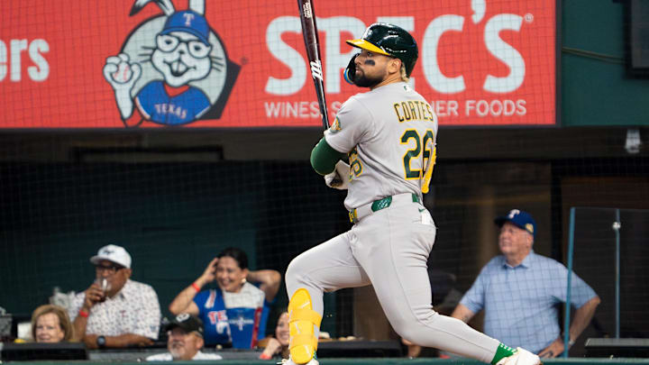 Apr 26, 2026; Arlington, Texas, USA;  Athletics left fielder Carlos Cortes (26) hits a two-run triple during the first inning against the Texas Rangers at Globe Life Field. Mandatory Credit: Raymond Carlin III-Imagn Images