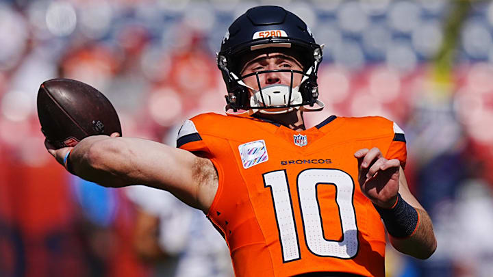 Oct 13, 2024; Denver, Colorado, USA; Denver Broncos quarterback Bo Nix (10) warms up before the game against the Los Angeles Chargers at Empower Field at Mile High. 