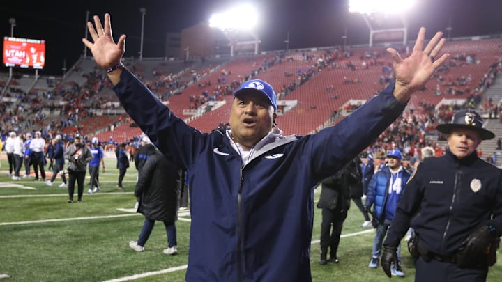 Kalani Sitake celebrates a Holy War victory with the fans.