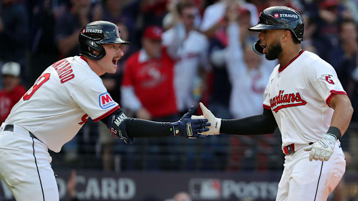 Cleveland Guardians right fielder George Valera (35) celebrates with Kyle Manzardo (9) after scoring during the fourth inning of Game 3 of the American League Wild Card Series at Progressive Field, Oct. 2, 2025, in Cleveland, Ohio.