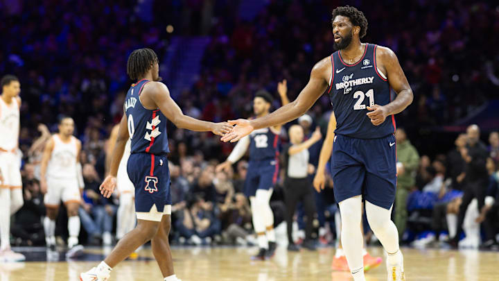 Jan 22, 2024; Philadelphia, Pennsylvania, USA; Philadelphia 76ers center Joel Embiid (21) reacts with guard Tyrese Maxey (0) after an assist during the third quarter against the San Antonio Spurs at Wells Fargo Center. Mandatory Credit: Bill Streicher-Imagn Images