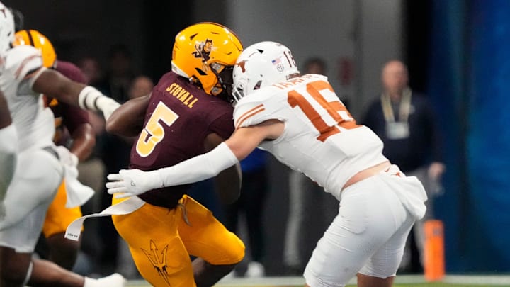 Arizona State wide receiver Melquan Stovall (5) is tackled by Texas defensive back Michael Taaffe (16) after a catch during the fourth quarter in the Chick-fil-A Peach Bowl in Atlanta on Wednesday, Jan. 1, 2025. Arizona State wide receiver Melquan Stovall (5) is tackled by Texas defensive back Michael Taaffe (16) after a catch during the fourth quarter in the Chick-fil-A Peach Bowl in Atlanta on Wednesday, Jan. 1, 2025.
