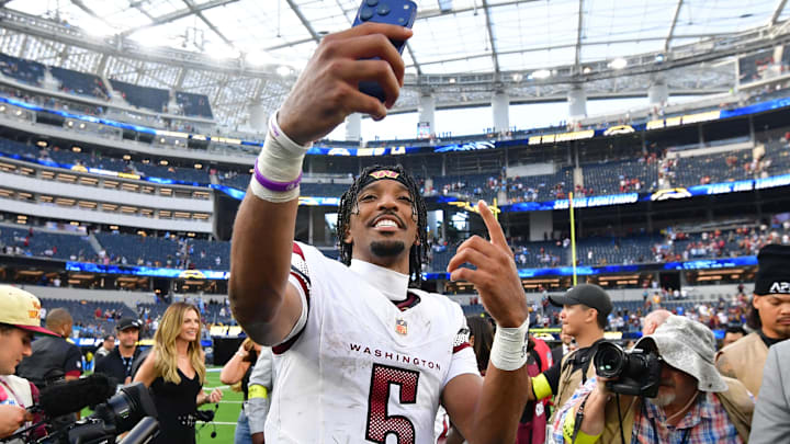 Washington Commanders quarterback Jayden Daniels (5) celebrates after the game against the Los Angeles Chargers at SoFi Stadium. 