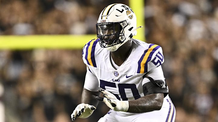 Oct 26, 2024; College Station, Texas, USA; LSU Tigers offensive lineman Emery Jones Jr. (50) lines up during the second quarter against the Texas A&M Aggies. The Aggies defeated the Tigers 38-23; at Kyle Field. Mandatory Credit: Maria Lysaker-Imagn Images. Oct 26, 2024; College Station, Texas, USA; LSU Tigers offensive lineman Emery Jones Jr. (50) lines up during the second quarter against the Texas A&M Aggies. The Aggies defeated the Tigers 38-23; at Kyle Field. Mandatory Credit: Maria Lysaker-Imagn Images.