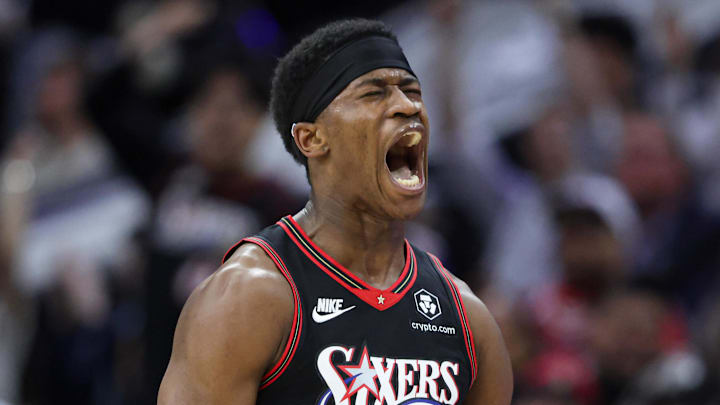 Philadelphia 76ers guard VJ Edgecombe (77) reacts after his three-pointer against the Oklahoma City Thunder during the fourth quarter at Xfinity Mobile Arena on March 23, 2026.