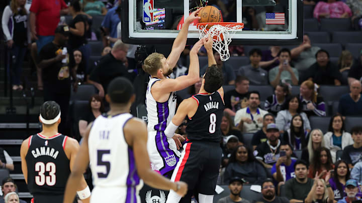 Oct 13, 2024; Sacramento, California, USA; Sacramento Kings forward Domantas Sabonis (11) drives to the basket against Portland Trail Blazers forward Deni Avdija (8) during the first quarter at Golden 1 Center. Mandatory Credit: Sergio Estrada-Imagn Images Oct 13, 2024; Sacramento, California, USA; Sacramento Kings forward Domantas Sabonis (11) drives to the basket against Portland Trail Blazers forward Deni Avdija (8) during the first quarter at Golden 1 Center. Mandatory Credit: Sergio Estrada-Imagn Images