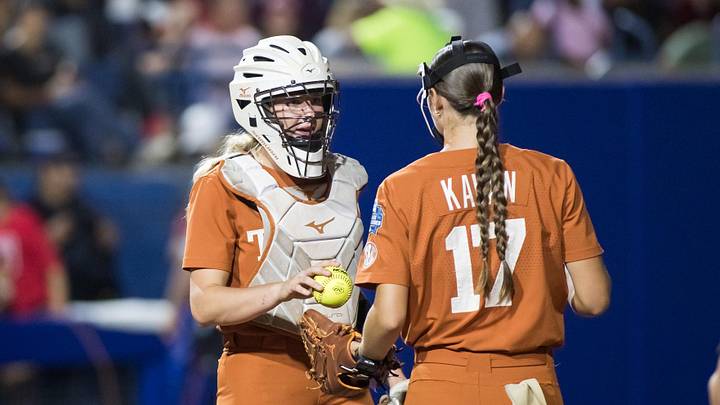 Jun 5, 2025; Oklahoma City, OK, USA; Texas Longhorns utility Reese Atwood (14) talks to pitcher Teagan Kavan (17). Jun 5, 2025; Oklahoma City, OK, USA; Texas Longhorns utility Reese Atwood (14) talks to pitcher Teagan Kavan (17).
