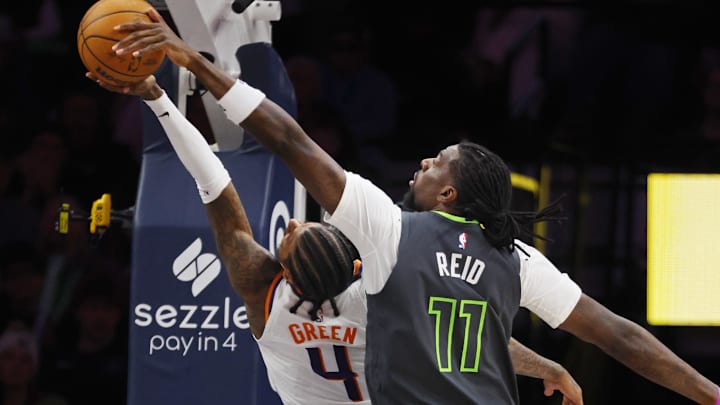 Mar 17, 2026; Minneapolis, Minnesota, USA; Minnesota Timberwolves center Naz Reid (11) blocks a shot by Phoenix Suns guard Jalen Green (4) in the fourth quarter at Target Center.