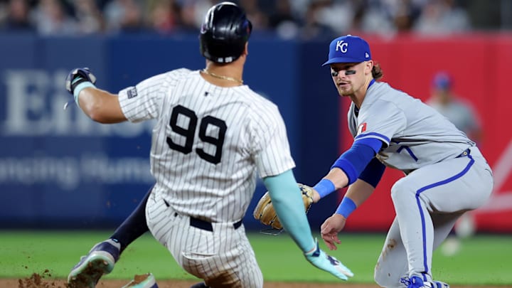 Sep 9, 2024; Bronx, New York, USA; Kansas City Royals shortstop Bobby Witt Jr. (7) tags out New York Yankees designated hitter Aaron Judge (99) at second base to complete a double play on a ball hit by Yankees catcher Austin Wells (not pictured) during the fifth inning at Yankee Stadium. Mandatory Credit: Brad Penner-Imagn Images