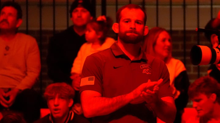 Oklahoma State head wrestling coach David Taylor watches player introductions during the college wrestling dual between Oklahoma State and Air Force at Gallagher-Iba Arena in Stillwater, Okla., Friday, Jan., 3, 2025. Oklahoma State head wrestling coach David Taylor watches player introductions during the college wrestling dual between Oklahoma State and Air Force at Gallagher-Iba Arena in Stillwater, Okla., Friday, Jan., 3, 2025.