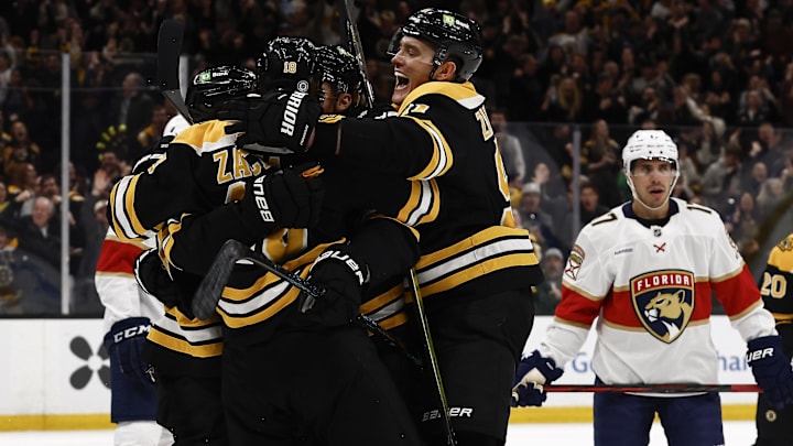 Mar 11, 2025; Boston, Massachusetts, USA; Boston Bruins defenseman Nikita Zadorov (91) joins the celebration after center Pavel Zacha (18) scored the go ahead goal as Florida Panthers center Evan Rodrigues (17) looks away during the third period at TD Garden. Mandatory Credit: Winslow Townson-Imagn Images