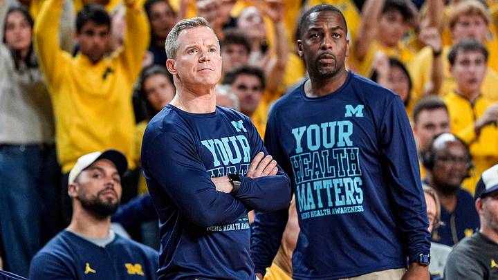 Michigan head coach Dusty May and assistant coach Mike Boynton Jr. Michigan head coach Dusty May and assistant coach Mike Boynton Jr.