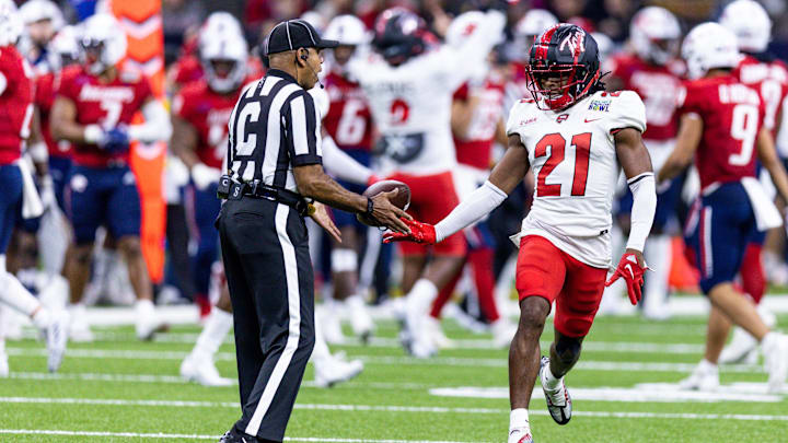 Dec 21, 2022; New Orleans, Louisiana, USA;  Western Kentucky Hilltoppers defensive back Upton Stout (21) reacts after intercepting a pass against the South Alabama Jaguars during the second half at Caesars Superdome. Mandatory Credit: Stephen Lew-Imagn Images